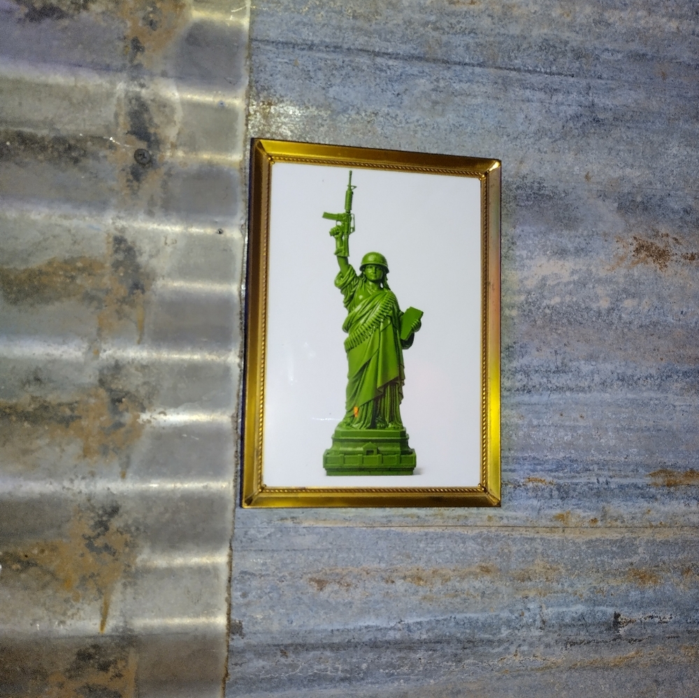 Lady Liberty Plastic Army Man Framed Art Print By Neon Nicho